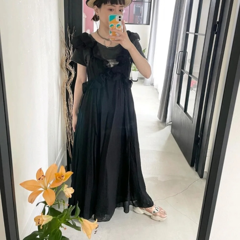 H&M NWT lyocell blend flounced black dress. Long with open back with a tie clos